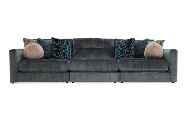 Emerald green Jewels 131'' 3-piece modular sofa in glam style, polyester fabric upholstery, with plush cushions and patterned accent pillows.