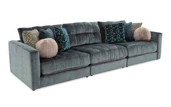 Emerald green Jewels 131'' 3-piece modular sofa in glam style with plush polyester fabric, Bob-O-Pedic gel memory foam cushions, and decorative accent pillows.