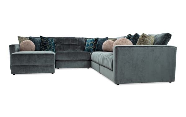 Emerald green Jewels 6-piece modular sectional sofa with plush polyester fabric, Bob-O-Pedic gel memory foam cushions, accent pillows, and hidden storage ottoman in glam style.