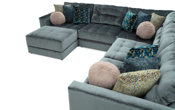 Emerald green Jewels 6-piece modular sectional with plush polyester fabric, Bob-O-Pedic gel memory foam, accent pillows, and storage ottoman.