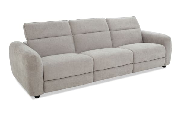 Modern three-seater sofa upholstered in light gray fabric with plush cushions, wide armrests, and a contemporary design ideal for living rooms.