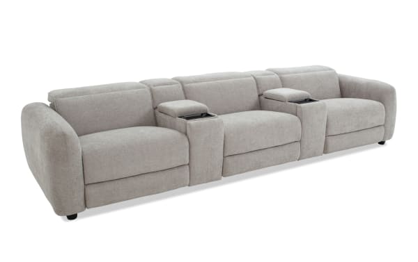 Modern light gray fabric sectional sofa with wide armrests, built-in storage compartments, and plush cushioning for living room seating.