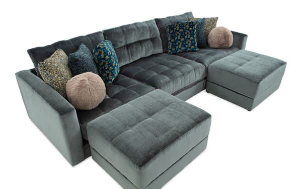 Emerald green Jewels 131" 5-piece modular sectional sofa with plush polyester fabric, Bob-O-Pedic gel memory foam, glam style, and two storage ottomans.