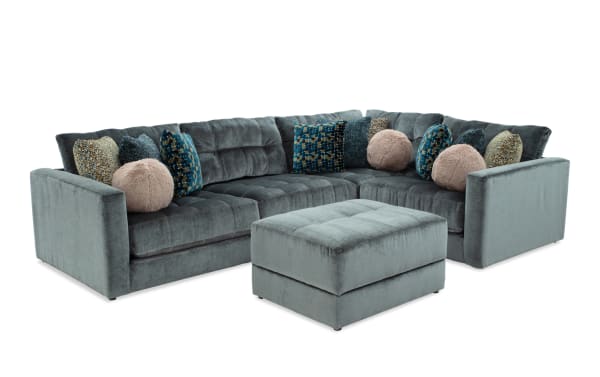 Emerald green Jewels 5-piece modular sectional with plush polyester fabric, Bob-O-Pedic gel memory foam cushions, accent pillows, and storage ottoman.