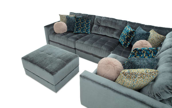 Emerald green Jewels 92" 5-piece modular sectional with plush polyester fabric, gel memory foam cushions, accent pillows, and storage ottoman.