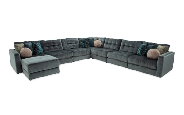 Emerald green Jewels 8-piece modular sectional sofa with plush polyester fabric, Bob-O-Pedic gel memory foam, accent pillows, and storage ottoman in glam style.