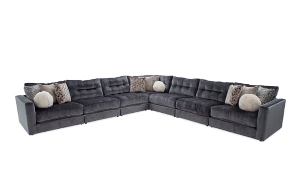 Charcoal gray Jewels 7-piece modular sectional sofa with plush polyester fabric, Bob-O-Pedic gel memory foam cushions, and assorted accent pillows in glam style.
