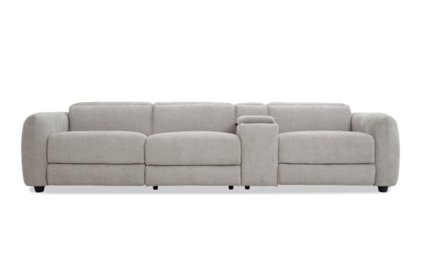 Modern beige fabric sectional sofa with plush cushions, wide armrests, and a central console, ideal for living room comfort and style.