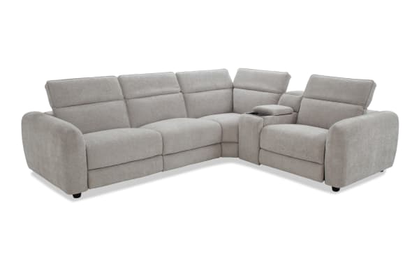 Light gray fabric sectional sofa with plush cushions, adjustable headrests, and a built-in center console with cup holders, designed for modern living rooms.