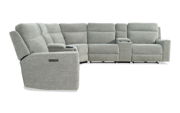 Gray fabric sectional recliner sofa with padded armrests, cup holders, and adjustable headrests, designed for modern living rooms.