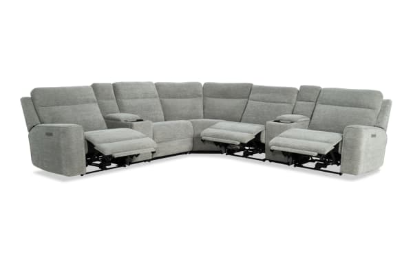 Gray fabric sectional sofa with three power recliners, corner design, padded armrests, and cup holders, ideal for living room comfort.