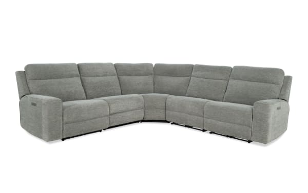 Gray fabric sectional sofa with reclining seats, padded armrests, and modern design, ideal for living room comfort and style.