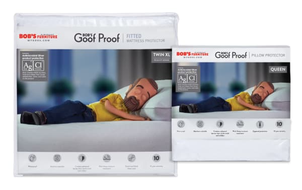 Basic Twin XL Mattress & Queen Pillow Protector Bundle by Bob’s Discount Furniture, featuring antimicrobial silver protection. White nylon and cotton terry fabric with waterproof, breathable, and moisture-wicking properties. Mattress protector has elasticized fitted sheet style; pillow protector has zippered slip style for easy removal. Both offer stain and odor resistance with a natural cotton terry surface for comfort and hygiene. Includes 10-year warranty.