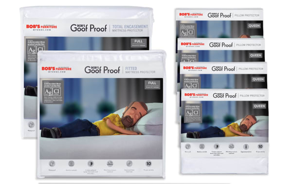 Bob’s Furniture Goof Proof Best Full Mattress & Pillow Protector Bundle featuring nylon and cotton terry materials. Includes a white total encasement mattress protector with zipper closure, waterproof and antimicrobial silver protection, and a fitted mattress protector with elasticized edges. Also includes four white zippered pillow protectors with breathable, soft cotton terry surface. Designed for full-size mattresses, offering mold, mildew, bed bug, dust mite resistance, and easy care with machine washable fabric.