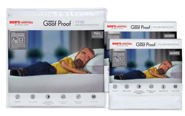 Basic Full Mattress & Pillow Protector Bundle by Bob’s Discount Furniture featuring antimicrobial silver protection. Includes full-size fitted mattress protector and queen-size zippered pillow protectors. Made with breathable, natural white Cotton Terry surface and nylon backing. Waterproof, wick-away moisture treatment, elasticized fitted sheet style for easy use. Machine washable, stain-resistant mattress and pillow covers designed for durability and hygiene. 10-year warranty.