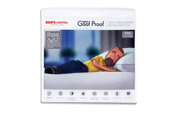 Bob’s Discount Furniture Goof Proof Total Encasement King Mattress Protector in white nylon and cotton terry, antimicrobial silver protection, waterproof, machine washable, with mite-tight seams and moisture-wicking treatment.