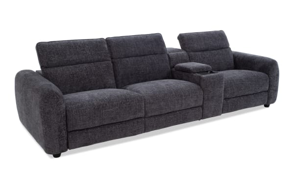Dark gray fabric sectional sofa with plush cushions, adjustable headrests, and a built-in center console with storage, ideal for modern living rooms.