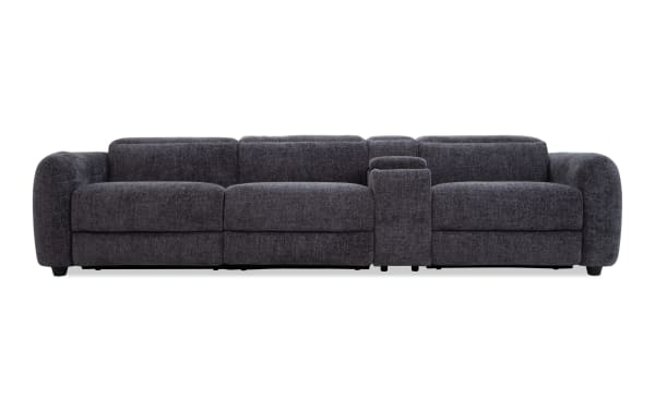 Dark gray fabric sectional sofa with plush cushions, rounded armrests, and a built-in center console for storage and cup holders, ideal for modern living rooms.