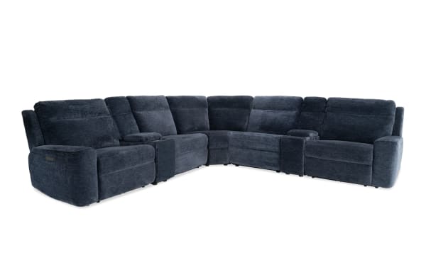 Dark blue fabric sectional sofa with plush cushioning, reclining seats, and built-in cup holders, designed for comfort and modern living rooms.