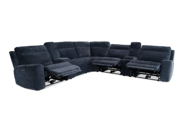 Dark blue fabric sectional sofa with three reclining seats, plush cushions, and padded armrests, designed for living room comfort.