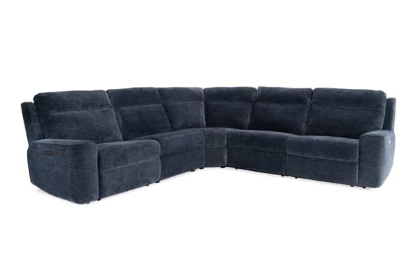 Dark blue fabric sectional sofa with plush cushions and reclining seats, designed for modern living room comfort and style.