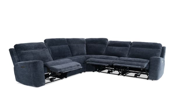 Dark blue fabric sectional sofa with reclining seats, plush cushioning, and modern design, ideal for comfortable living room seating.