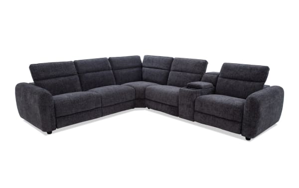 Dark gray fabric L-shaped sectional sofa with plush cushions, wide armrests, and a built-in center console for storage and cup holders.