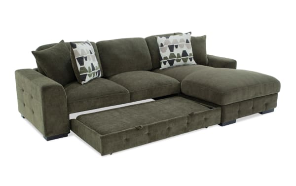 Playground Forest 116'' 2 Piece Right Arm Facing Pop-Up Sleeper Chaise Sectional in green polyester fabric with memory foam cushions, tufted detailing, and storage ottoman.