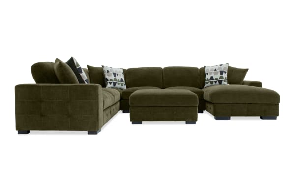 Plush green Playground Forest 4-piece sectional with right arm chaise, polyester fabric, hand-tufted detailing, storage ottoman, and pop-up sleeper loveseat.