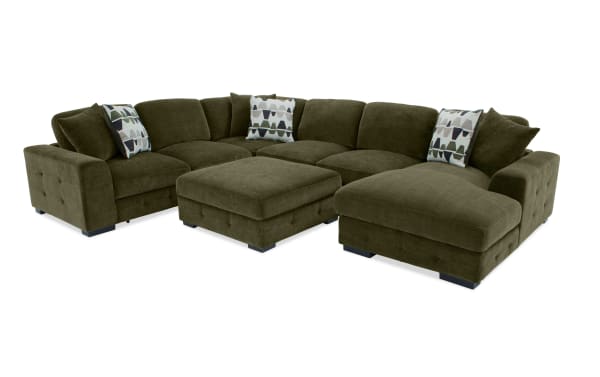 Playground Forest 145" 4-piece right arm facing sectional in green polyester fabric with pop-up sleeper loveseat, storage chaise, and six oversized accent pillows.