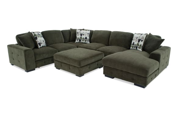 Playground Forest 145'' 4-piece right arm facing sectional in green polyester fabric with pop-up sleeper loveseat, storage chaise, tufted detailing, and oversized accent pillows.