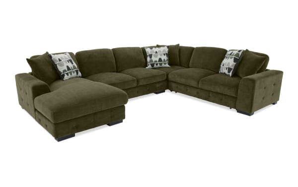 Plush green Playground Forest 145'' 4-piece left-arm sectional with pop-up sleeper chaise, polyester upholstery, memory foam cushions, and storage.