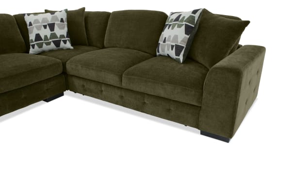 Playground Forest 145'' left arm facing pop-up sleeper chaise sectional in green polyester fabric with tufted detailing, storage ottoman, and oversized accent pillows.
