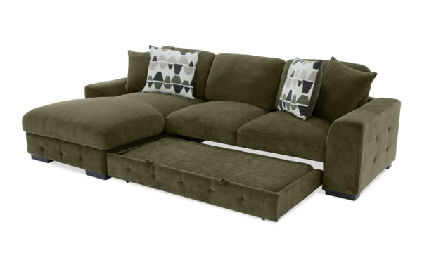 Playground Forest 116" green fabric polyester sectional with left arm pop-up sleeper chaise, storage ottoman, tufted detailing, and oversized pillows.