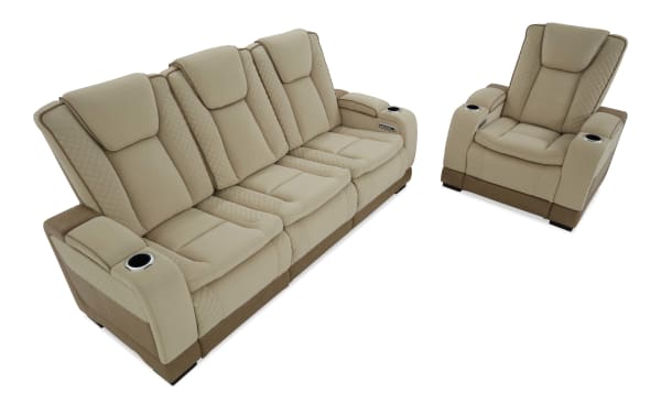 Beige leather reclining sofa set with quilted stitching, includes a three-seat couch and a matching armchair with cup holders and padded armrests.