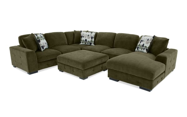 Transitional Playground Forest 145'' green fabric polyester sectional with right arm chaise, storage ottoman, tufted detailing, and oversized accent pillows.