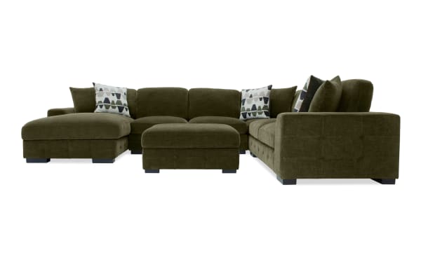 Playground Forest 145'' 4-piece left arm facing chaise sectional in green polyester fabric with storage ottoman, memory foam cushions, tufted detailing, and oversized accent pillows. Transitional style, versatile seating with sleeper loveseat pop-up function.