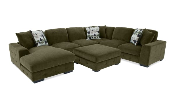 Playground Forest 145'' green fabric polyester 4-piece sectional with left arm chaise, storage ottoman, memory foam cushions, tufted detailing, and oversized pillows in transitional style.