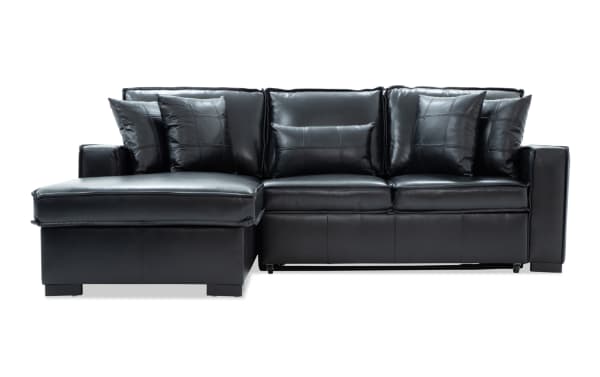 Black leather sectional sofa with chaise lounge on the left, featuring stitched square pattern cushions and a modern design suitable for living room seating.