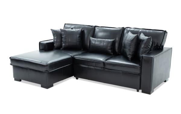Black leather sectional sofa with chaise lounge, featuring plush cushions and a modern, sleek design ideal for living room seating.