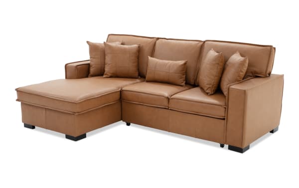 Modern brown leather sectional sofa with chaise lounge, cushioned armrests, and multiple matching pillows, ideal for living room seating.