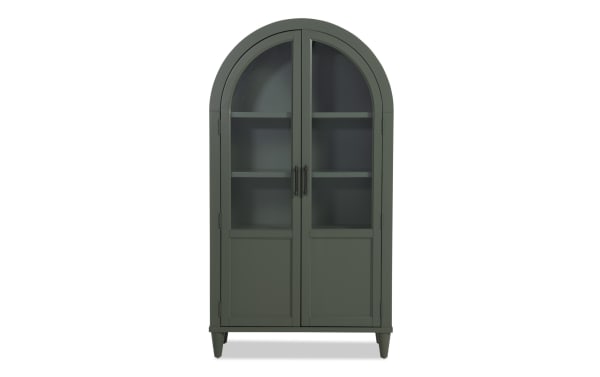 Domus Green Arch Cabinet in transitional style, made of rubberwood solids and MDF, featuring a tall green arched silhouette with glass-paneled doors.