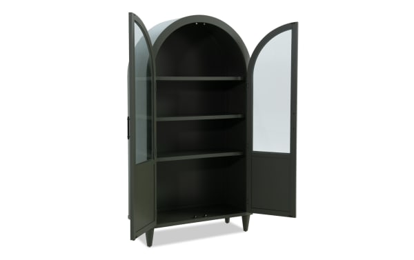 Domus Green Arch Cabinet in transitional style, made of rubberwood solids and MDF, features a tall green arched silhouette with glass-paneled doors and three interior shelves for stylish storage and display.