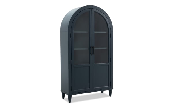 Domus Navy Arch Cabinet in transitional style, featuring navy rubberwood and MDF with arched top, glass-paneled doors, and tapered legs for elegant storage.