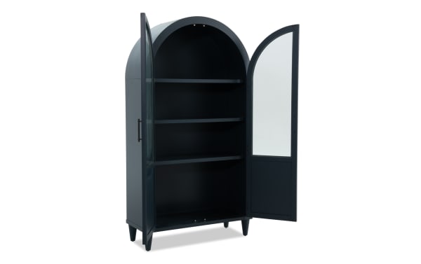 Domus Navy Arch Cabinet in transitional style, made of navy rubberwood solids and MDF, with arched top, glass-paneled doors, and three interior shelves.