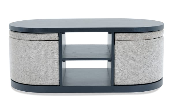 Contemporary Hampton Black & Gray Oval Storage Coffee Table with gray polyester fabric, MDF frame, open shelves, and hidden storage compartments.