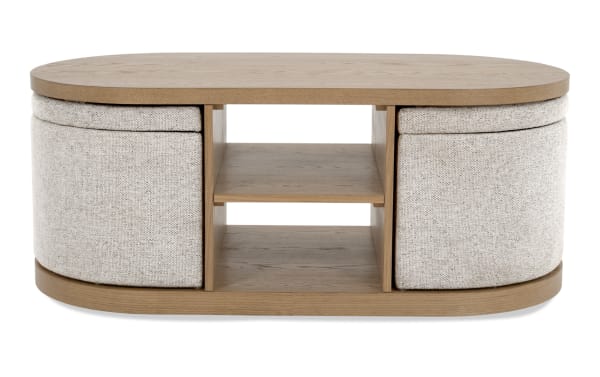 Contemporary Hampton Natural & Beige Oval Storage Coffee Table with fabric polyester beige upholstery, MDF wood, open shelves, and curved edges.