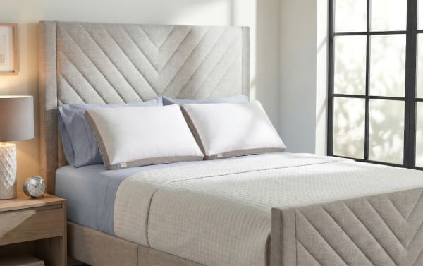 Set of 2 Adjustable King Pillows from My Crescent & Cloud™, featuring white soft-touch covers with gray trim, plush down alternative fibers, and dual airflow memory foam inserts for personalized support and comfort.