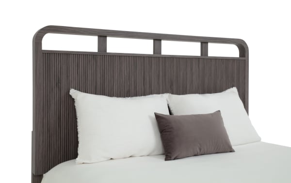 Cascade Queen Gray Panel Bed headboard with transitional style, engineered wood grain MDF, featuring intricate reeding, smooth corners, and symmetrical openings.