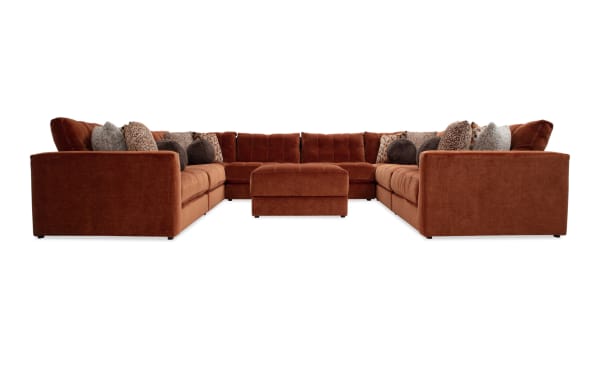 Jewels Spice 170'' 9-piece modular sectional in orange polyester fabric with gel memory foam, accent pillows, and storage ottoman, glam style.